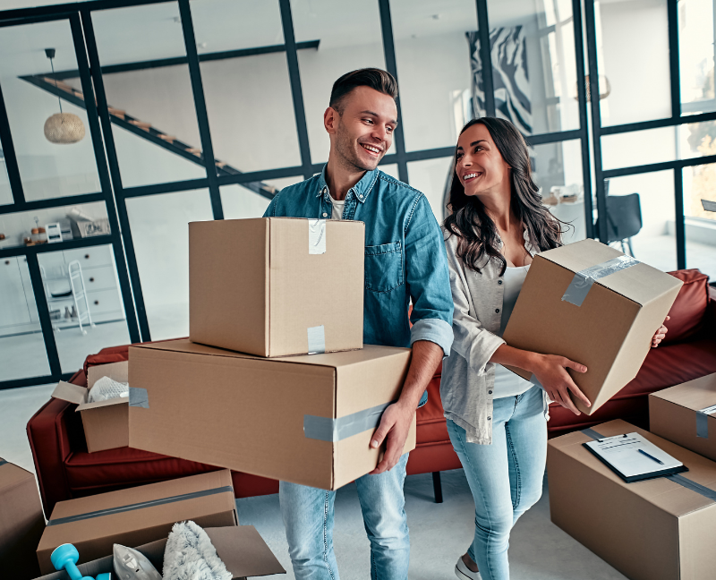 couple packing in new home