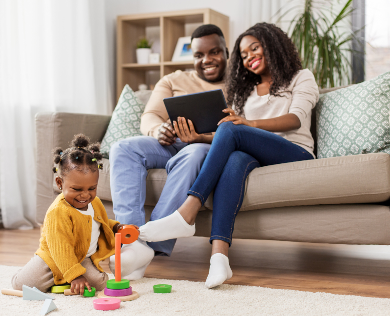 couple at sofa with kids