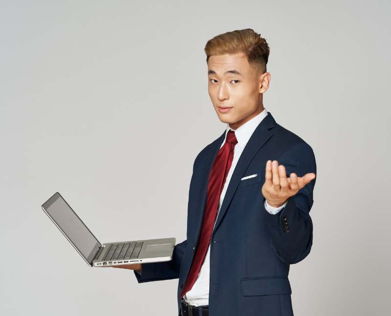 real estate agent holding laptop