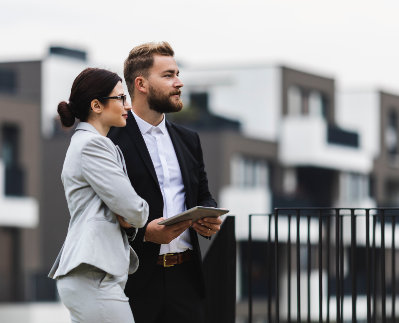 real estate agents looking at something