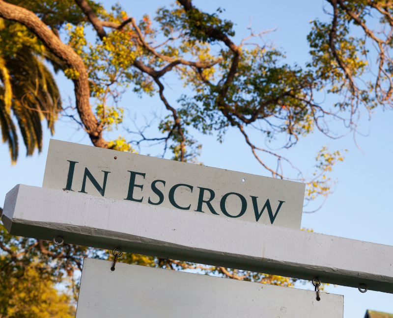 in escrow sign