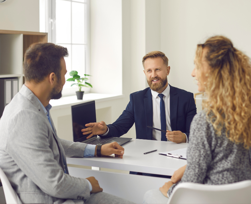 real estate agent talking to a couple