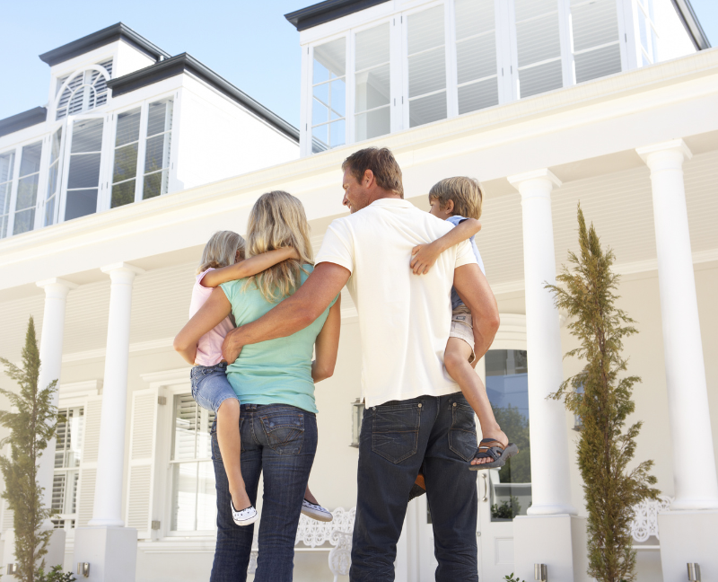 family looking at their new home