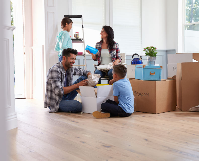 family unpacking to new home