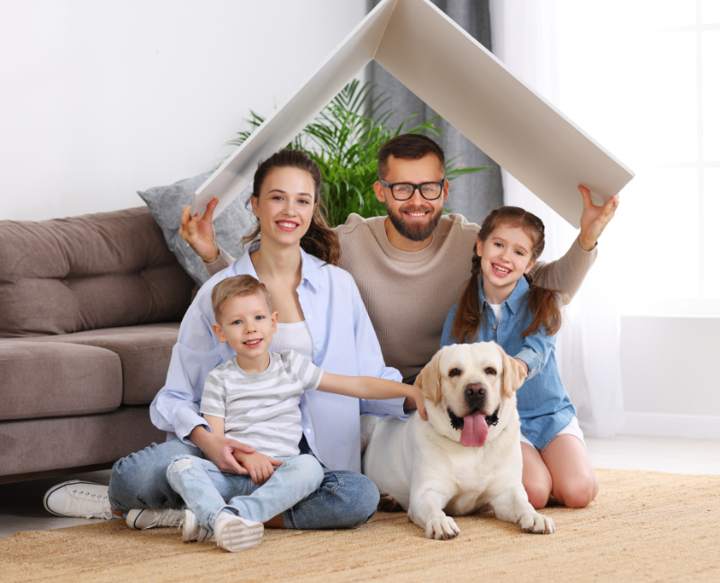 family with pet dog to new home