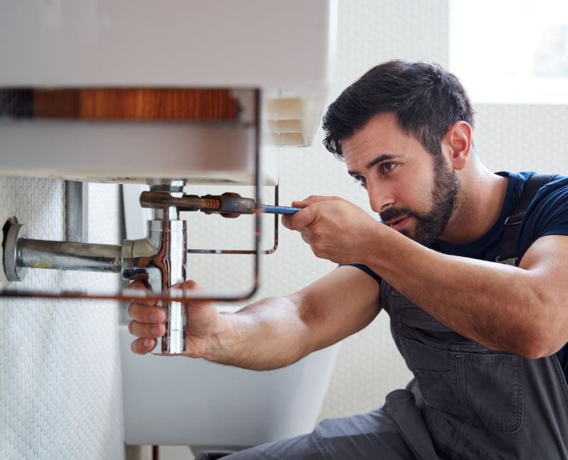 home owner checking faucet for leaks part 1