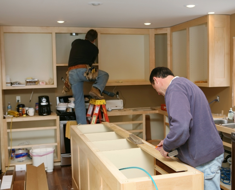 men remodeling kitchen