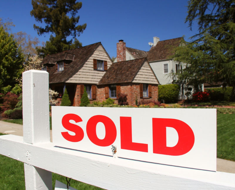 house with sold sign