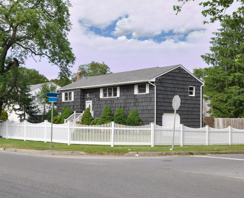 white fence corner lot