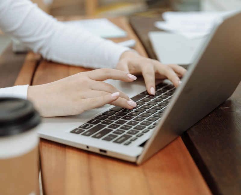 agent typing on a laptop