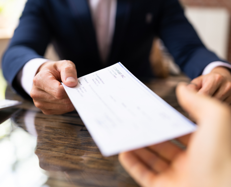 realtor handing cheque